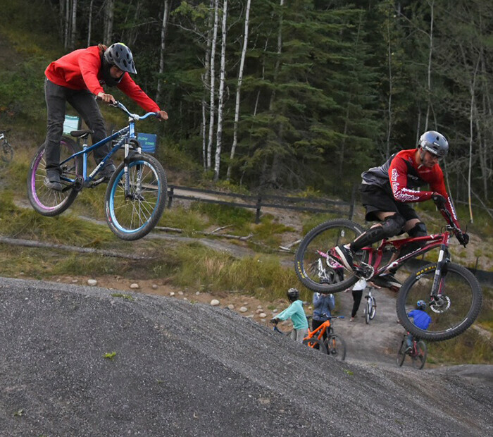 Bikes going over a jump