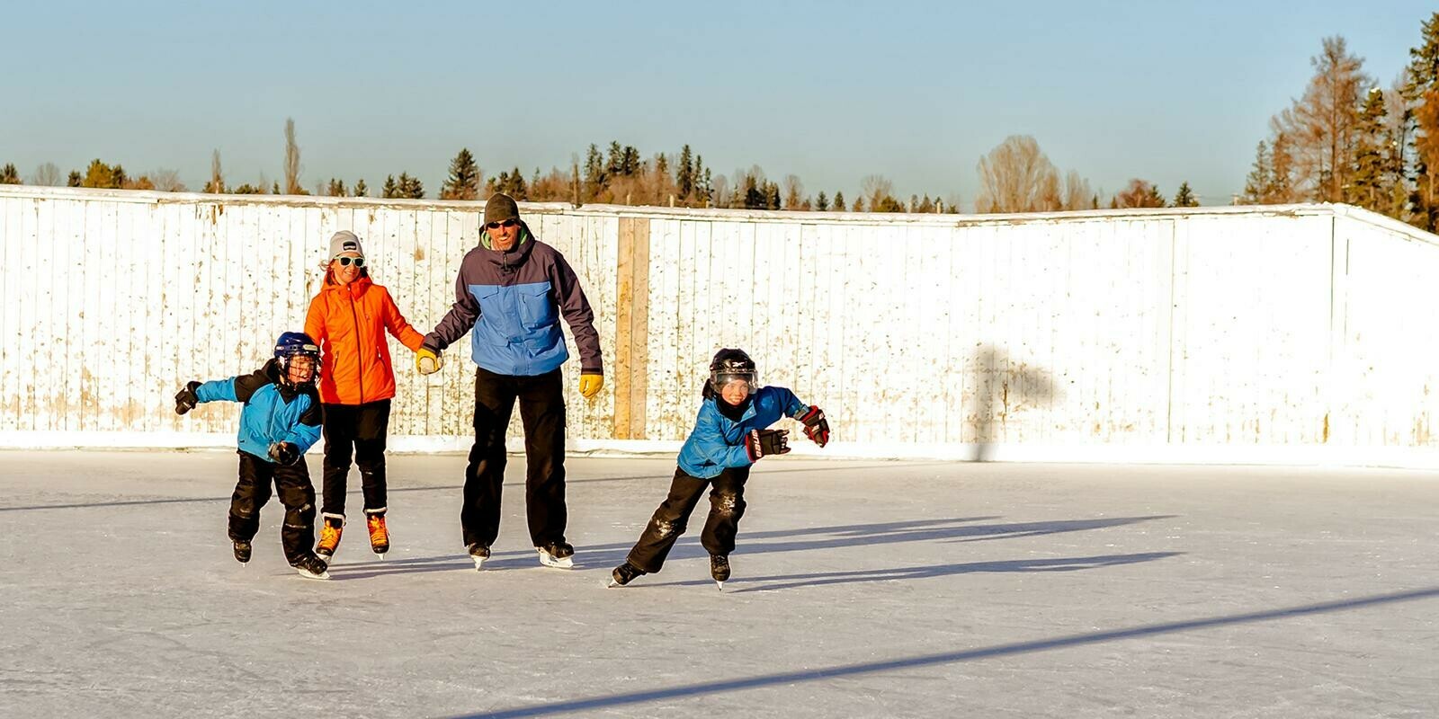 Family skating on outdoor rink