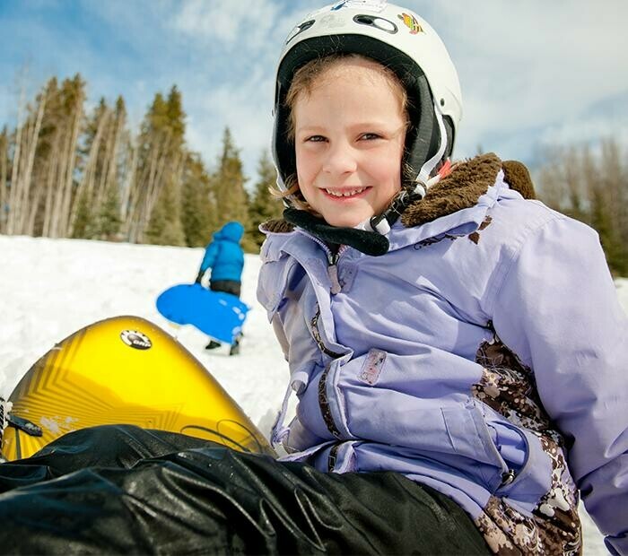 Young girl sledding at Willmore Park
