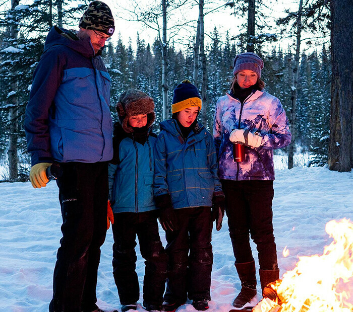 Family by a campfire